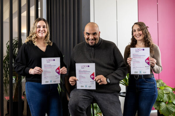 Paperstone team members who have been First Aid trained, holding up their certificates.