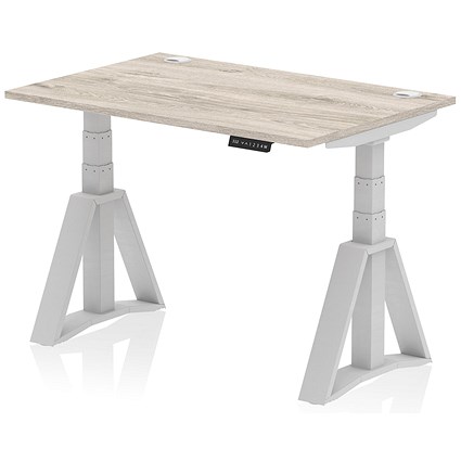 Air 1200mm Height Adjustable Cable Port Desk, Silver Leg with Piste Foot, Grey Oak Air 1200mm Height Adjustable Cable Port Desk, Silver Leg with Piste Foot, Grey Oak